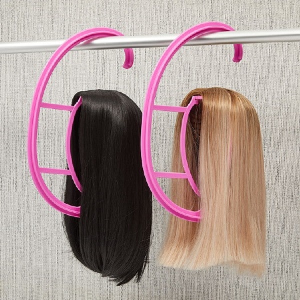 Store wigs on hanging wig stands